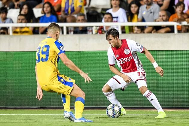 NICOSIA , 20-08-2019 , GSP Stadium , Champions League playoff, season 2019-2020 , APOEL Nicosia player Roman Bezjak, Ajax player Nicolas Tagliafico during the match APOEL Nicosia - Ajax APOEL Nicosia - Ajax  x4149522x Copyright: