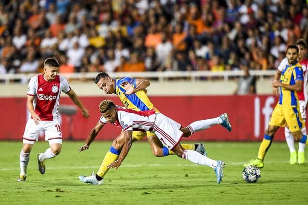 NICOSIA , 20-08-2019 , GSP Stadium , Champions League playoff, season 2019-2020 , Ajax player David Neres, APOEL Nicosia player Lucas Souza during the match APOEL Nicosia - Ajax APOEL Nicosia - Ajax  x4149571x Copyright: