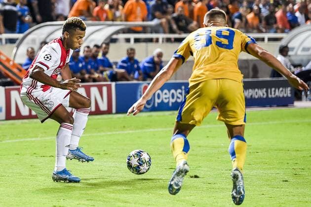 NICOSIA , 20-08-2019 , GSP Stadium , Champions League playoff, season 2019-2020 , Ajax player David Neres, APOEL Nicosia player Roman Bezjak during the match APOEL Nicosia - Ajax APOEL Nicosia - Ajax  x4149712x Copyright: