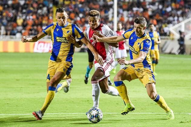 NICOSIA , 20-08-2019 , GSP Stadium , Champions League playoff, season 2019-2020 , APOEL Nicosia player Urosh Matich, Ajax player David Neres, APOEL Nicosia player Dragan Mihajlovic during the match APOEL Nicosia - Ajax APOEL Nicosia - Ajax  x4149880x Copyright: