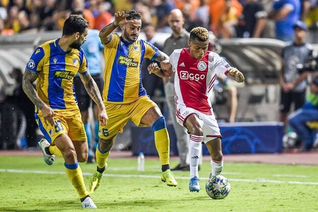 NICOSIA , 20-08-2019 , GSP Stadium , Champions League playoff, season 2019-2020 , APOEL Nicosia player Savvas Gentsoglou, Ajax player David Neres during the match APOEL Nicosia - Ajax APOEL Nicosia - Ajax  x4149886x Copyright: