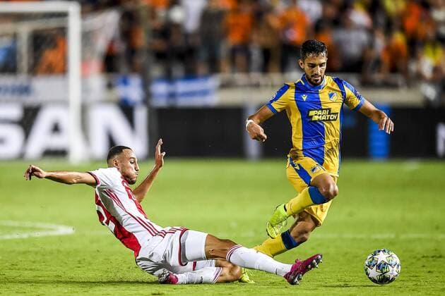 NICOSIA , 20-08-2019 , GSP Stadium , Champions League playoff, season 2019-2020 , Ajax player Noussair Mazraoui, APOEL Nicosia player Musa Suleiman during the match APOEL Nicosia - Ajax APOEL Nicosia - Ajax  x4149887x Copyright: