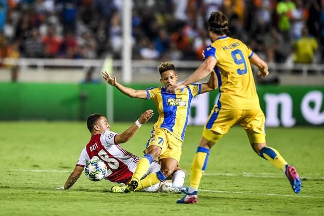 NICOSIA , 20-08-2019 , GSP Stadium , Champions League playoff, season 2019-2020 , Ajax player Sergino Dest, APOEL Nicosia player Andre Vidigal during the match APOEL Nicosia - Ajax APOEL Nicosia - Ajax  x4149984x Copyright: