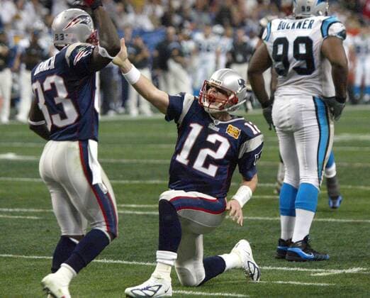 February 1, 2004, Houston, TX, USA: New England Patriots quarterback Tom Brady (12) makes a first-down gesture after carrying the ball for 12 yards early in the second quarter of Super Bowl XXXVIII against Carolina Panthers at Reliant Stadium in Houston on February 1, 2004. Scott Fowler: A Super Bowl, a bear hug and 6 other memorable Panthers-Patriots moments - ZUMAm67_ 20040201_zaf_m67_012 Copyright: xRonxJenkinsx