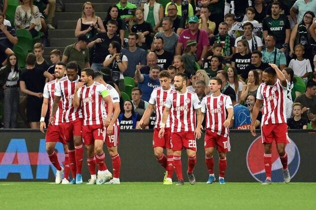 KRASNODAR, RUSSIA - AUGUST 27, 2019: Olympiacos FC players celebrate a goal in the sesond leg of the 2019-20 UEFA Champions League play-off football match between FC Krasnodar and Olympiacos CFP at Krasnodar Stadium; third left: Omar Elabdellaoui; third right: Mathieu Valbuena; second right: Daniel Podence. Maxim Romanov TASS  TS0B8327