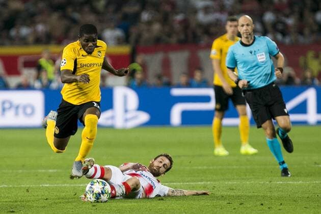 27th August 2019, Rajko Mitic Stadium, Belgrade, Serbia; UEFA Champions league football, qualifying, Red Star Belgrade versus Young Boys; Milos Degenek of Red Star Belgrade misses the tackle on Roger Assale of Young Boys - Editorial Use Only  ActionPlus12163655 NikolaxKristic