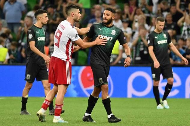 KRASNODAR, RUSSIA - AUGUST 27, 2019: Olympiacos FC s Giorgos Masuras (2nd L) and FC Krasnodar s Wanderson (3rd L) after the senond leg of the 2019-20 UEFA Champions League play-off football match between FC Krasnodar and Olympiacos FC at Krasnodar Stadium; Olympiacos FC won 2-1. Maxim Romanov TASS  TS0B835E