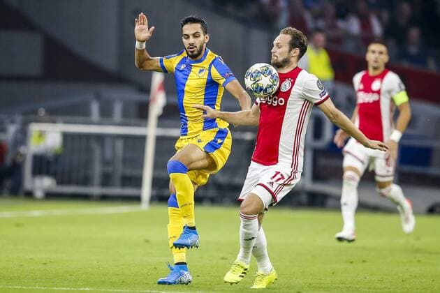 AMSTERDAM , 29-08-2019 , Johan Cruijff ArenA , Champions League playoff, season 2019-2020 , APOEL Nicosia player Musa Suleiman, Ajax player Daley Blind during the match Ajax - APOEL Nicosia Ajax - APOEL Nicosia  x4211678x Copyright: