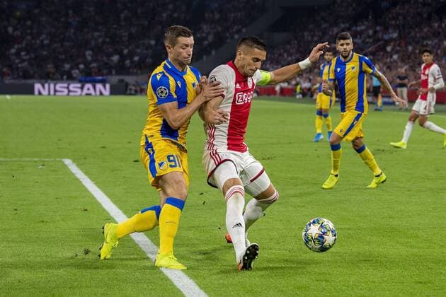 AMSTERDAM , 29-08-2019 , Johan Cruijff ArenA , Champions League playoff, season 2019-2020 , APOEL Nicosia player Dragan Mihajlovic and Ajax player Dusan Tadic during the match Ajax - APOEL Nicosia Ajax - APOEL Nicosia  x4211726x Copyright: