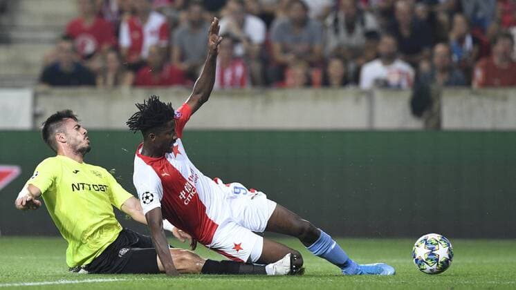 From left ANDREI BURCA of CFR and PETER OLAYINKA of Slavia in action during the Football Champions League 4th qualifying round return match: Slavia Prague vs Cluj-Napoca in Sinobo Stadium, Prague, Czech Republic, August 28, 2019. (CTKxPhoto MichalxKamaryt) CTKPhotoP201908281000001  _KMT6605