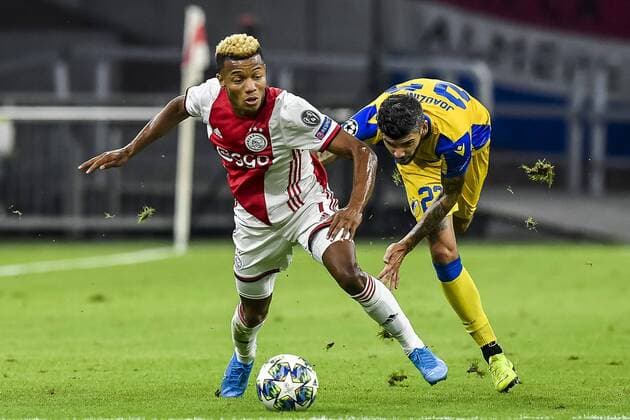 AMSTERDAM , 29-08-2019 , Johan Cruijff ArenA , Champions League playoff, season 2019-2020 , Ajax player David Neres, APOEL Nicosia player Joaozinho during the match Ajax - APOEL Nicosia Ajax - APOEL Nicosia  x4212105x Copyright: