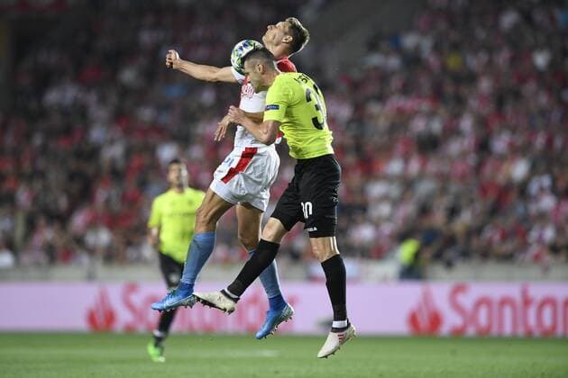 From left MILAN SKODA of Slavia and ANDREI MURESAN of CFR Cluj - Napoca in action during the Football Champions League 4th qualifying round return match: Slavia Prague vs Cluj-Napoca in Sinobo Stadium, Prague, Czech Republic, August 28, 2019. (CTKxPhoto MichalxKamaryt) CTKPhotoP201908281014301  _KMT6659-1