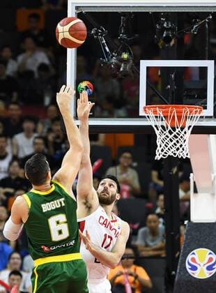 (190901) -- DONGGUAN, Sept. 1, 2019 -- Owen Klassen (R) of Canada blocks the shoot from Andrew Bogut of Australia during the group H match between Australia and Canada at the 2019 FIBA World Cup in Dongguan, south China s Guangdong Province, Sept.1, 2019. ) (SP)CHINA-DONGGUAN-BASKETBALL WM FIBA WORLD CUP-GROUP H-AUSTRALIA VS CANADA (CN) DengxHua 