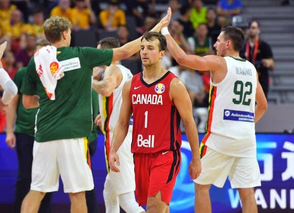 (190903) -- DONGGUAN, Sept. 3, 2019 -- Kevin Pangos (C) of Canada leaves the court after the group H match between Lithuania and Canada at the 2019 FIBA World Cup in Dongguan, south China s Guangdong Province, Sept. 3, 2019. ) (SP)CHINA-DONGGUAN-BASKETBALL WM FIBA WORLD CUP-GROUP H-LITHUANIA VS CANADA (CN) ZhuxZheng 