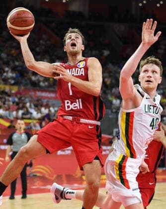 (190903) -- DONGGUAN, Sept. 3, 2019 -- Kevin Pangos (L) of Canada goes to the basket as Marius Grigonis of Lithuania defends during the group H match between Lithuania and Canada at the 2019 FIBA World Cup in Dongguan, south China s Guangdong Province, Sept. 3, 2019. ) (SP)CHINA-DONGGUAN-BASKETBALL WM FIBA WORLD CUP-GROUP H-LITHUANIA VS CANADA (CN) DengxHua 