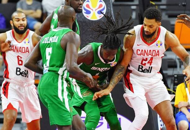 (190905) -- DONGGUAN, Sept. 5, 2019 -- Maurice Ndour (2nd R) of Senegal vies with Khem Birch (1st R) of Canada during the group H match between Senegal and Canada at the 2019 FIBA World Cup in Dongguan, south China s Guangdong Province, Sept. 5, 2019. ) (SP)CHINA-DONGGUAN-BASKETBALL WM FIBA WORLD CUP-GROUP H-SENEGAL VS CANADA (CN) ZhuxZheng 