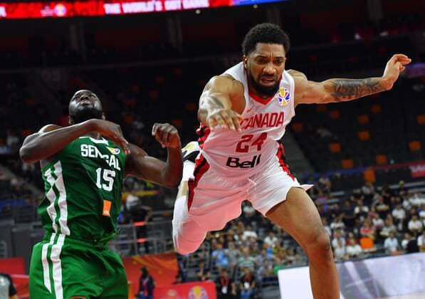 (190905) -- DONGGUAN, Sept. 5, 2019 -- Khem Birch (R) of Canada competes with Youssoupha Ndoye of Senegal during the group H match between Senegal and Canada at the 2019 FIBA World Cup in Dongguan, south China s Guangdong Province, Sept. 5, 2019. ) (SP)CHINA-DONGGUAN-BASKETBALL WM FIBA WORLD CUP-GROUP H-SENEGAL VS CANADA (CN) ZhuxZheng 