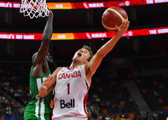 (190905) -- DONGGUAN, Sept. 5, 2019 -- Kevin Pangos (R) of Canada goes to the basket during the group H match between Senegal and Canada at the 2019 FIBA World Cup in Dongguan, south China s Guangdong Province, Sept. 5, 2019. ) (SP)CHINA-DONGGUAN-BASKETBALL WM FIBA WORLD CUP-GROUP H-SENEGAL VS CANADA (CN) ZhuxZheng 