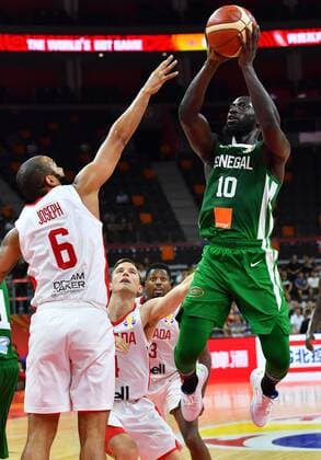 (190905) -- DONGGUAN, Sept. 5, 2019 -- Lamine Sambe (R) of Senegal shoots as Cory Joseph of Canada defends during the group H match between Senegal and Canada at the 2019 FIBA World Cup in Dongguan, south China s Guangdong Province, Sept. 5, 2019. ) (SP)CHINA-DONGGUAN-BASKETBALL WM FIBA WORLD CUP-GROUP H-SENEGAL VS CANADA (CN) ZhuxZheng 