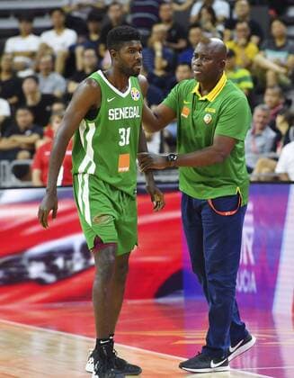 (190905) -- DONGGUAN, Sept. 5, 2019 -- Moustapha Gaye (R), head coach of Senegal consoles Babacar Toure of Senegal during the group H match between Senegal and Canada at the 2019 FIBA World Cup in Dongguan, south China s Guangdong Province, Sept. 5, 2019. ) (SP)CHINA-DONGGUAN-BASKETBALL WM FIBA WORLD CUP-GROUP H-SENEGAL VS CANADA (CN) ZhuxZheng 