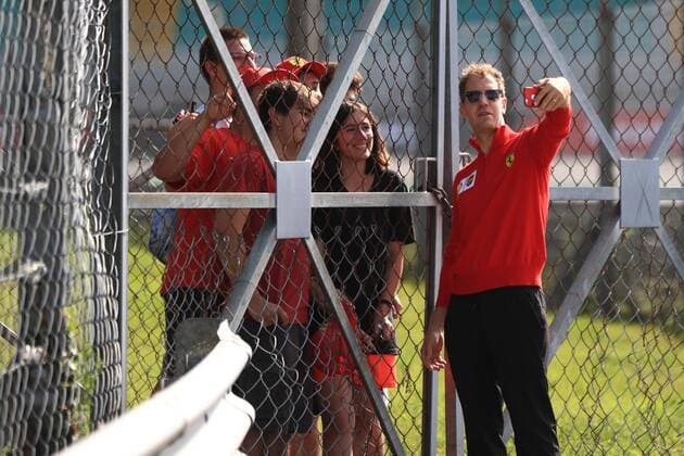 5th September 2019; Autodromo Nazionale, Monza, Italy; Formula 1 Grand Prix of Italy, team arrival day; Scuderia Ferrari, Sebastian Vettel stops during track walk to talk to fans - Editorial Use Only.  ActionPlus12165284 Octane