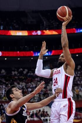 Canadian professional basketball player Khem Birch, right, jumps to pass the ball at the 17-32 classification round of Group P Canada vs Jordan 2019 FIBA Basketball World Cup in Shanghai, China, 7 September 2019. Canada defeated Jordan at the 17-32 classification round of Group P 2019 FIBA Basketball World Cup 126-71. Canada defeated Jordan at the 17-32 classification round of Group P 2019 FIBA Basketball World Cup  749907350174564379