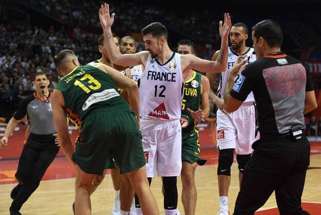 (190907) -- NANJING, Sept. 7, 2019 -- Nando de Colo (C) of France argues during the group L match between France and Lithuania at the 2019 FIBA World Cup in Nanjing, east China s Jiangsu Province, Sept. 7, 2019. ) (SP)CHINA-NANJING-BASKETBALL-FIBA WORLD CUP-GROUP L-FRA VS LTU(CN) HanxYuqing 