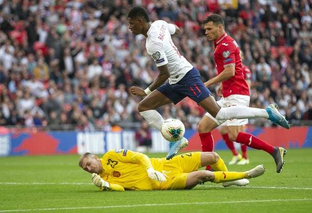 (190908) -- LONDON, Sept. 8, 2019 -- England s Marcus Rashford (Up) vies with Bulgaria s goalkeeper Plamen Iliev (Bottom) during the UEFA EURO, EM, Europameisterschaft,Fussball 2020 Qualifying Round Group A match between England and Bulgaria in London, Britain on Sept. 7, 2019. ) (SP)BRITAIN-LONDON-FOOTBALL-UEFA EURO 2020 QUALIFYING-GROUP A-ENGLAND VS BULGARIA HanxYan 
