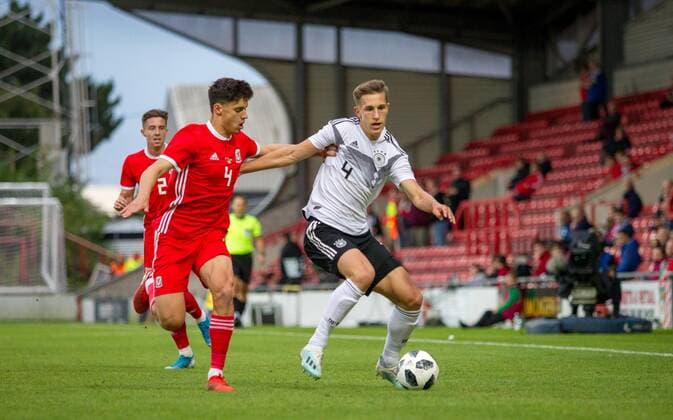 Nico Schlotterbeck (SC Freiburg) of Germany U21, U 21 battles Jack Evans (Swansea City) of Wales U21 during the UEFA EURO, EM, Europameisterschaft,Fussball U21 Qualifying match between Wales U21 & Germany U21 at The Racecourse Ground, Mold Rd, Wrexham LL11 2AH on 10 September 2019. Copyright: xJamesxxGillx PMI-3031-0031