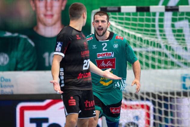 Minden, Deutschland 12.09.2019: 1. Handball-Bundesliga - 2019 2020 - GWD Minden vs. Die Eulen Ludwigshafen (L-R) Jerome Müller (Ludwigshafen), Lucas Meister (Minden) Minden Nordrhein-Westfalen Deutschland Kampa Halle