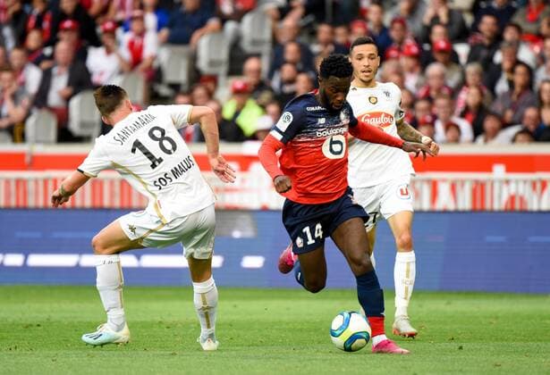 Fußball, OSC Lille - SCO Angers Jonathan Bamba ( LOSC ) - Baptiste Santamaria ( Angers ) FOOTBALL : Lille OSC vs Angers SCO - Ligue 1 - Lille - 13 09 2019 FedericoPestellini Panoramic 