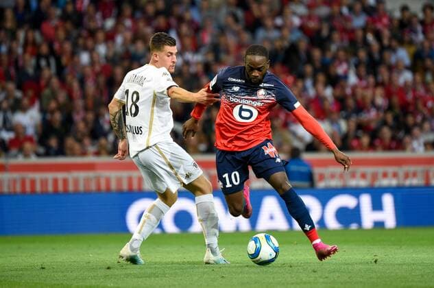 Fußball, OSC Lille - SCO Angers Jonathan Ikone ( LOSC ) - Baptiste Santamaria ( Angers ) FOOTBALL : Lille OSC vs Angers SCO - Ligue 1 - Lille - 13 09 2019 FedericoPestellini Panoramic 