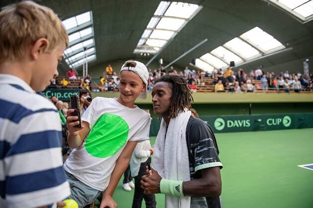 2019 Davis Cup Sweden v Israel 190914 Mikael Ymer of Sweden takes a selfie with a spectator after the Davis Cup qualification tennis match between Sweden and Israel on September 14, 2019 in Stockholm. Copyright: JOHANNAxLUNDBERG BB190914JL007