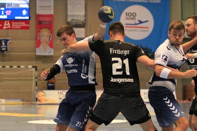 2.Bundesliga Handball VfL Luebeck-Schwartau - HC Elbflorenz 2006 14.09.2019, Hansehalle Luebeck, GER, VfL Luebeck-Schwartau - HC Elbflorenz 2006 im Bild picture shows Janik Schrader VfL Luebeck-Schwartau wird von Philip Jungemann (HC Elbflorenz 2006) gestoppt.