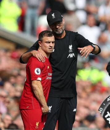 14th September 2019; Anfield, Liverpool, Merseyside, England; English Premier League Football, Liverpool versus Newcastle United; Liverpool manager Jurgen Klopp gives instructions to substitute Xherdan Shaqiri - Strictly Editorial Use Only. No use with unauthorized audio, video, data, fixture lists, club league logos or live services. Online in-match use limited to 120 images, no video emulation. No use in betting, games or single club league player publications ActionPlus12167286 DavidxBlunsden