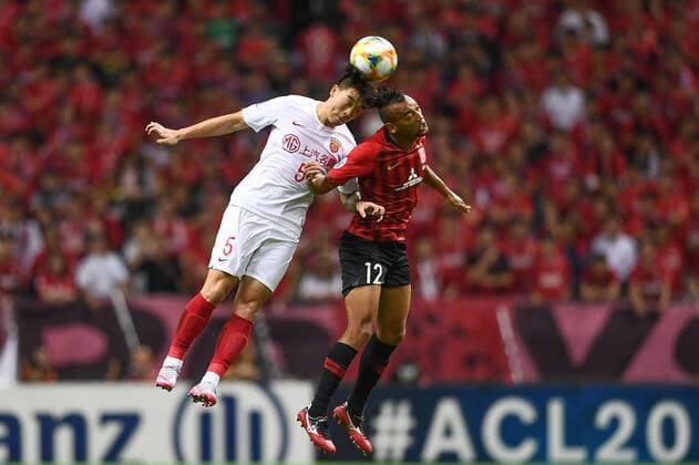 Brazilian football player Fabricio dos Santos Messias, or simply Fabricio, of Urawa Red Diamonds, right, jumps for the head ball during the second-round match of quarterfinal of AFC Champions League (ACL) against Shanghai SIPG in Saitama Prefecture, Japan, 17 September 2019. The second-round match of quarterfinal of AFC Champions League (ACL) between Urawa Red Diamonds and Shanghai SIPG ended with a 1-1 tie in Saitama Prefecture, Japan, 17 September 2019.