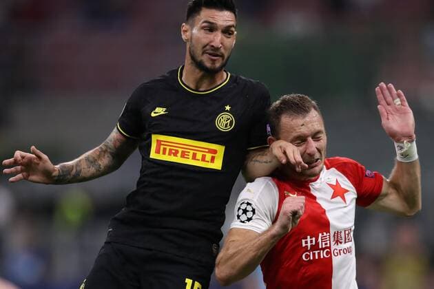Vladimir Coufal of Slavia Prague receives an arm in the face from Matteo Politano of Inter during the UEFA Champions League match at the San Siro, Milan. Picture date: 17th September 2019. Picture credit should read: Jonathan Moscrop Sportimage EDITORIAL USE ONLY. No use with unauthorised audio, video, data, fixture lists, club league logos or live services. Online in-match use limited to 120 images, no video emulation. No use in betting, games or single club league player publications. SPI-0207-0035