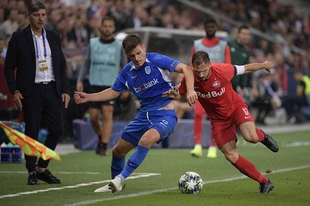 Genk s Joakim Maehle Pedersen and Salzburg s Andreas Ulmer fight for the ball during a game between Austrian club RB Salzburg and Belgian RC Genk, Tuesday 17 September 2019 in Salzburg, Austria, first match in the group stage of the UEFA Champions League. YORICKxJANSENS  x05666050x