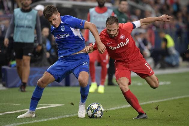 Genk s Joakim Maehle Pedersen and Salzburg s Andreas Ulmer fight for the ball during a game between Austrian club RB Salzburg and Belgian RC Genk, Tuesday 17 September 2019 in Salzburg, Austria, first match in the group stage of the UEFA Champions League. YORICKxJANSENS  x05666048x