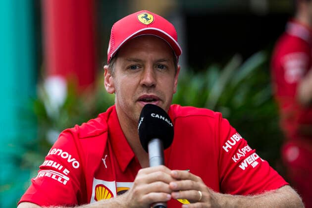19th September 2019; The Marina Bay Circuit, Marina Bay, Singapore; Formula One, Arrival Day; The number 5 Scuderia Ferrari driver Sebastian Vettel during an interview  ActionPlus12168704 StephenxBlackberry