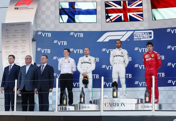 SOCHI, RUSSIA â€“ SEPTEMBER 29, 2019: Russia s Energy Minister Alexander Novak, Andrei Kostin, president and chairman of the management board at VTB Bank, Russia s Deputy Prime Minister Dmitry Kozak, Mercedes chief engineer Fred Judd, Mercedes AMG Petronas driver Valtteri Bottas of Finland, second-placed, Mercedes AMG Petronas driver Lewis Hamilton of the United Kingdom, first-placed, and Scuderia Ferrari F1 driver Charles Leclerc of Monaco, third-placed, from left, celebrate during the 2019 Formula One Russian Grand Prix victory ceremony at the Sochi Autodrom racing circuit. Sergei Fadeichev TASS  TS0BCCCA