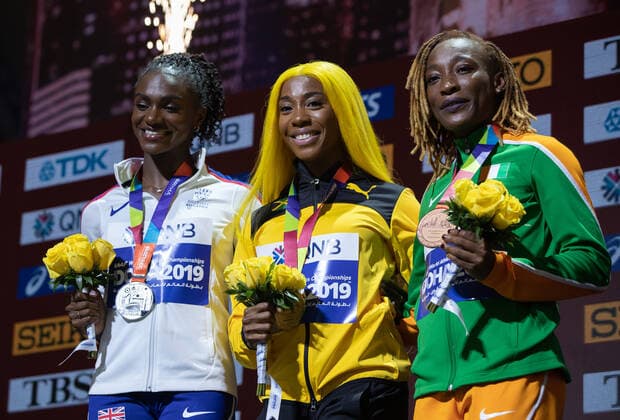 (191001) -- DOHA, Oct. 1, 2019 -- Shelly-Ann Fraser-Pryce (C) of Jamaica, Dina Asher-Smith (L) of Britain and Marie-Josee Ta Lou of Cote d Ivoire pose for photos during the awarding ceremony of the women s 100m final at the 2019 IAAF World Athletics Championships in Doha, Qatar, Sept. 30, 2019. ) (SP)QATAR-DOHA-IAAF WORLD ATHLETICS CHAMPIONSHIPS-WOMEN S 100M-AWARDING CEREMONY WangxJingqiang 
