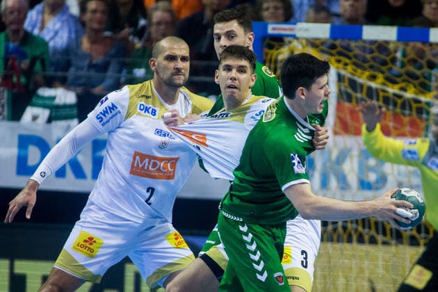 01.10.2019, xfrx, Handball DHB Pokal, Fuechse Berlin - SC Magdeburg emspor, v.l. Piotr Chrapkowski (SC Magdeburg),Simon Ernst (Fuechse Berlin) (DFL DFB REGULATIONS PROHIBIT ANY USE OF PHOTOGRAPHS as IMAGE SEQUENCES and or QUASI-VIDEO) Berlin