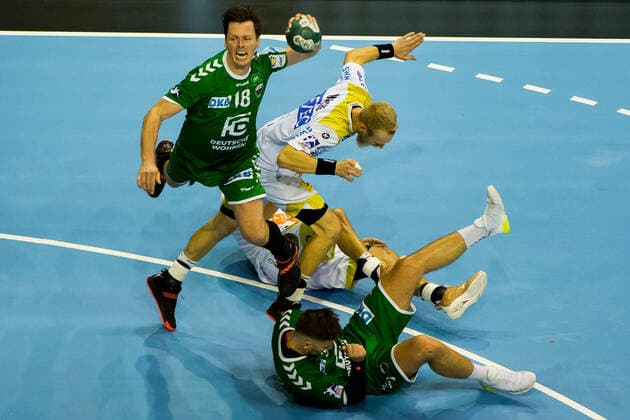 01.10.2019, xfrx, Handball DHB Pokal, Fuechse Berlin - SC Magdeburg emspor, v.l. Hans Lindberg (Fuechse Berlin),Matthias Musche (SC Magdeburg) (DFL DFB REGULATIONS PROHIBIT ANY USE OF PHOTOGRAPHS as IMAGE SEQUENCES and or QUASI-VIDEO) Berlin