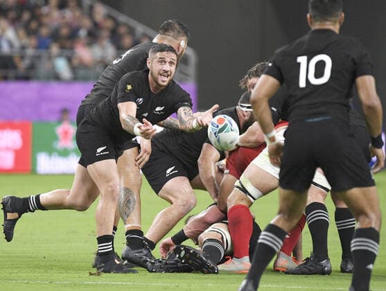 Rugby World Cup in Japan: New Zealand v Canada TJ Perenara (L) of New Zealand passes the ball during the first half of a Rugby World Cup Pool B match against Canada in Oita, southwestern Japan, on Oct. 2, 2019. 