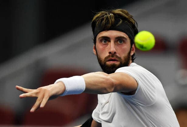 (191003) -- BEIJING, Oct. 3, 2019 -- Nikoloz Basilashvili of Georgia returns a shot during the men s singles second round match against Stefanos Tsitsipas of Greece at the 2019 China Open tennis tournament in Beijing, capital of China, Oct. 3, 2019. ) (SP)CHINA-BEIJING-TENNIS-CHINA OPEN-MEN S SINGLES(CN) LixYibo 