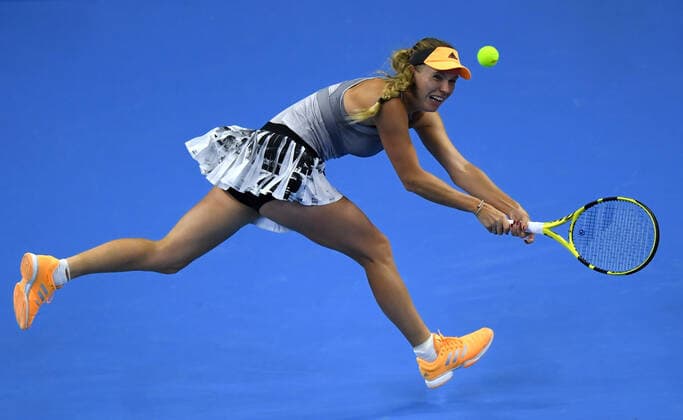 (191005) -- BEIJING, Oct. 5, 2019 -- Caroline Wozniacki of Denmark hits a return during the women s singles semifinal match against Naomi Osaka of Japan at 2019 China Open tennis tournament in Beijing, capital of China, Oct. 5, 2019. ) (SP)CHINA-BEIJING-TENNIS-CHINA OPEN-SEMIFINAL-WOMEN S SINGLES(CN) LixYibo 