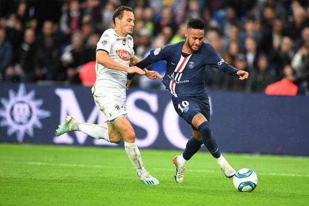 (191006) -- PARIS, Oct. 6, 2019 (Xinhua) -- Neymar JR (R) of Paris Saint-Germain vies with Antoine Bobichon of Angers during the Ligue 1 match between Paris Saint-Germain (PSG) and Angers at Parc des Princes in Paris, France, Oct. 5, 2019, (Photo by Jack Chan Xinhua) (SP)FRANCE-PARIS-LIGUE 1-PSG VS ANGERS 