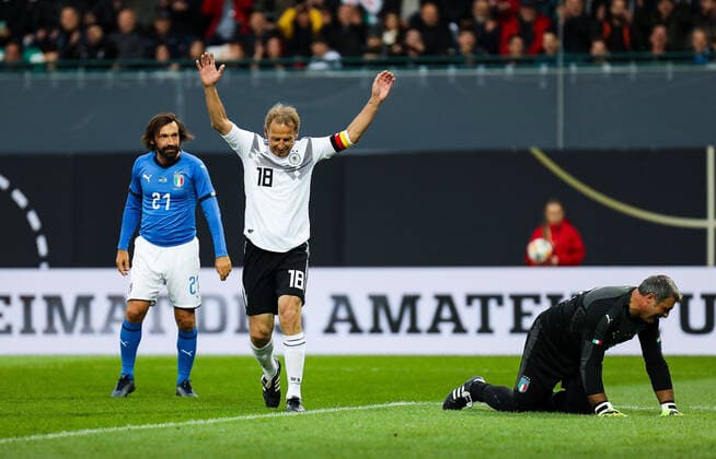 07.10.2019, xmkx, Fussball Legendenspiel, DFB-All-Stars - Azzurri Legends v.l. celebrating the goal, Jubel zum 2:0 fuer Deutschland GER durch Juergen Klinsmann (GER), Andrea Pirlo (ITA), Angelo Peruzzi (ITA) (DFL DFB REGULATIONS PROHIBIT ANY USE OF PHOTOGRAPHS as IMAGE SEQUENCES and or QUASI-VIDEO) Fuerth Bayern Deutschland (DE)