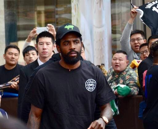 American professional basketball player Kyrie Irving of the Brooklyn Nets of the National Basketball Association NBA, Basketball Herren, USA , middle, shows up at a hotel before a NBA Oversea Game against Lakers in Shanghai, China, 8 October 2019.
